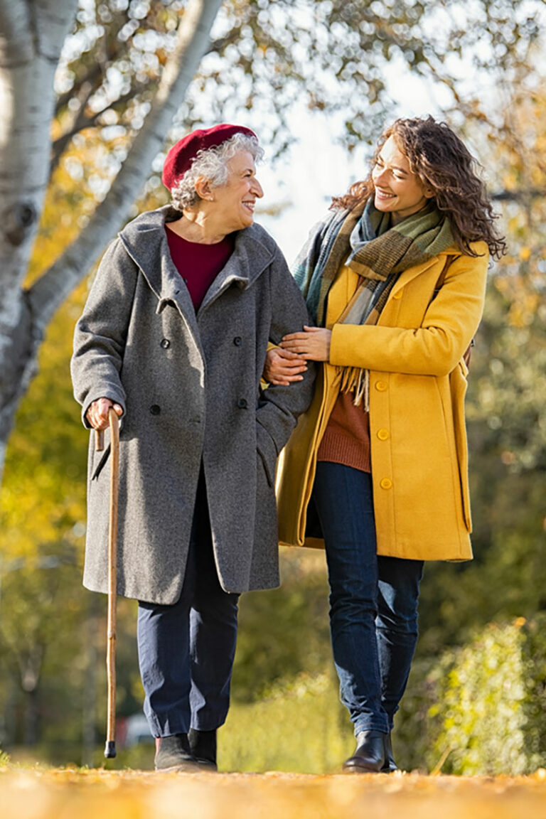 woman and mother walking outdoors in the fall colours