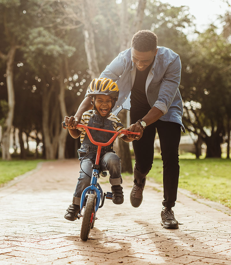 Man and son riding bike